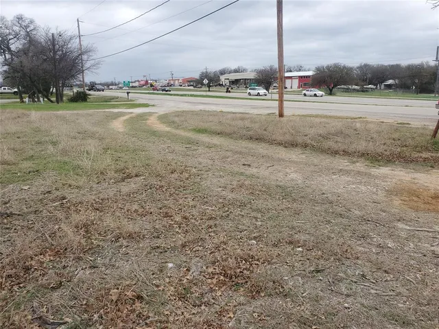 a view of a lake with houses in the back