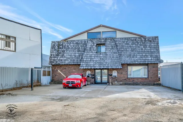 a front view of a house with parking