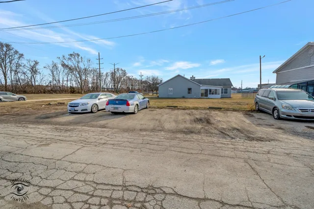 a view of street with parked cars