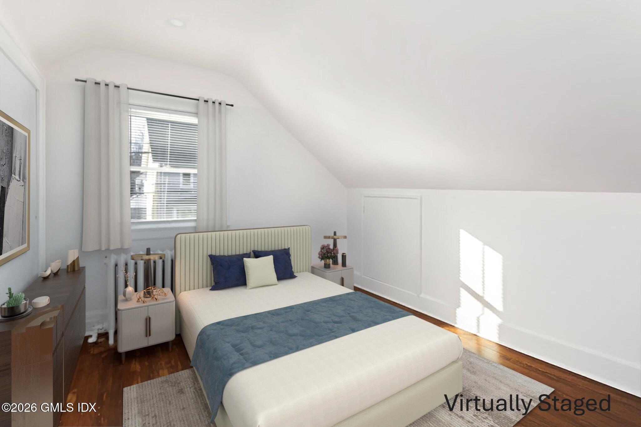 71 Prospect Street, Unit 2 Greenwich, CT 06830 - Photo 14 of 17 a bedroom with a large bed and a window
