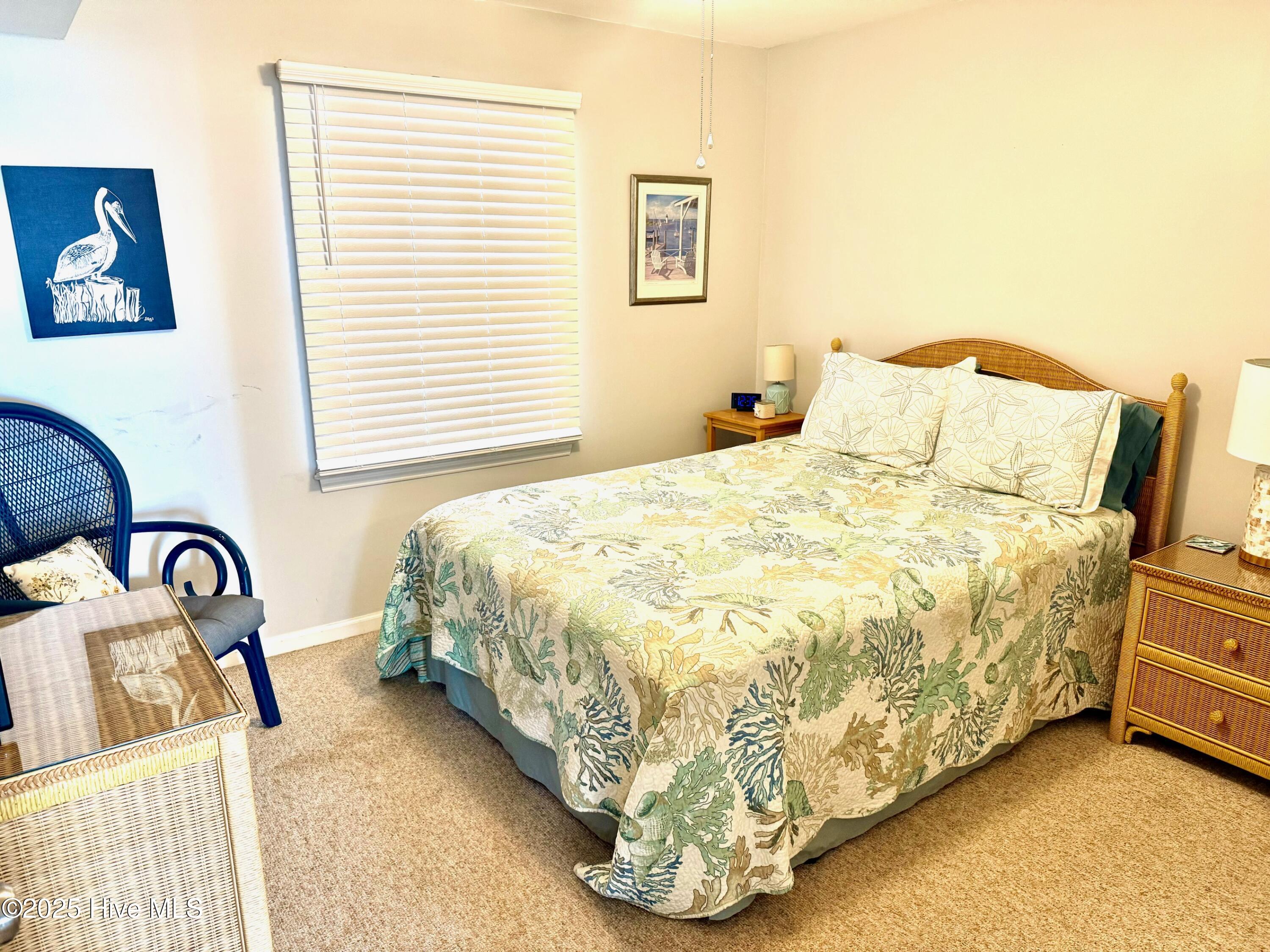 31 Ocean Isle W Boulevard, Unit 32 Ocean Isle Beach, NC 28469 - Photo 11 of 15 Secondary Bedroom with Queen Bed