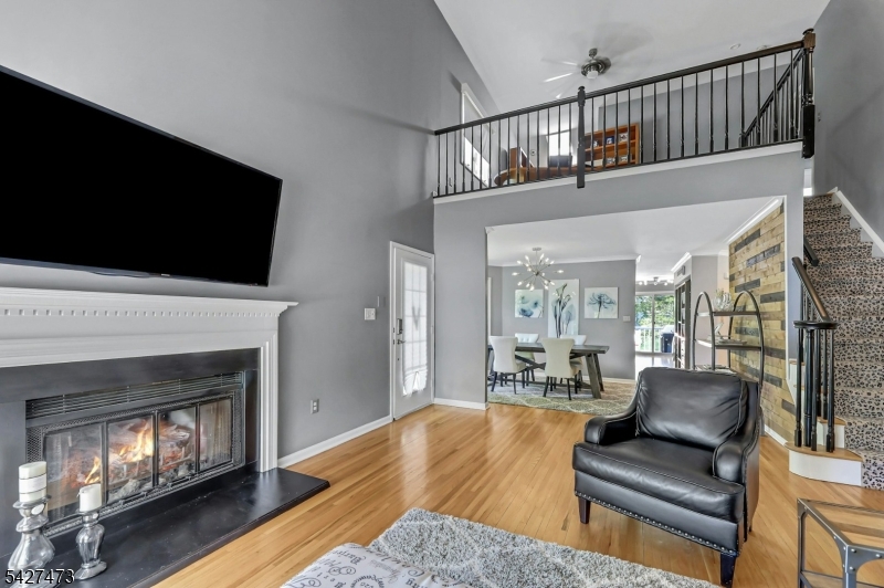 100 Easedale Road, Unit 100 Wayne, NJ 07470 - Photo 11 of 43 a living room with furniture fireplace and flat screen tv