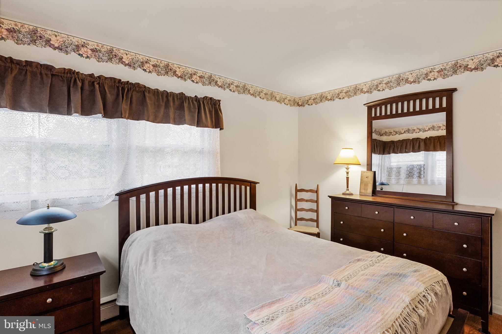 708 Bem Street Riverside, NJ 08075 - Photo 21 of 26 a bedroom with a bed and a window