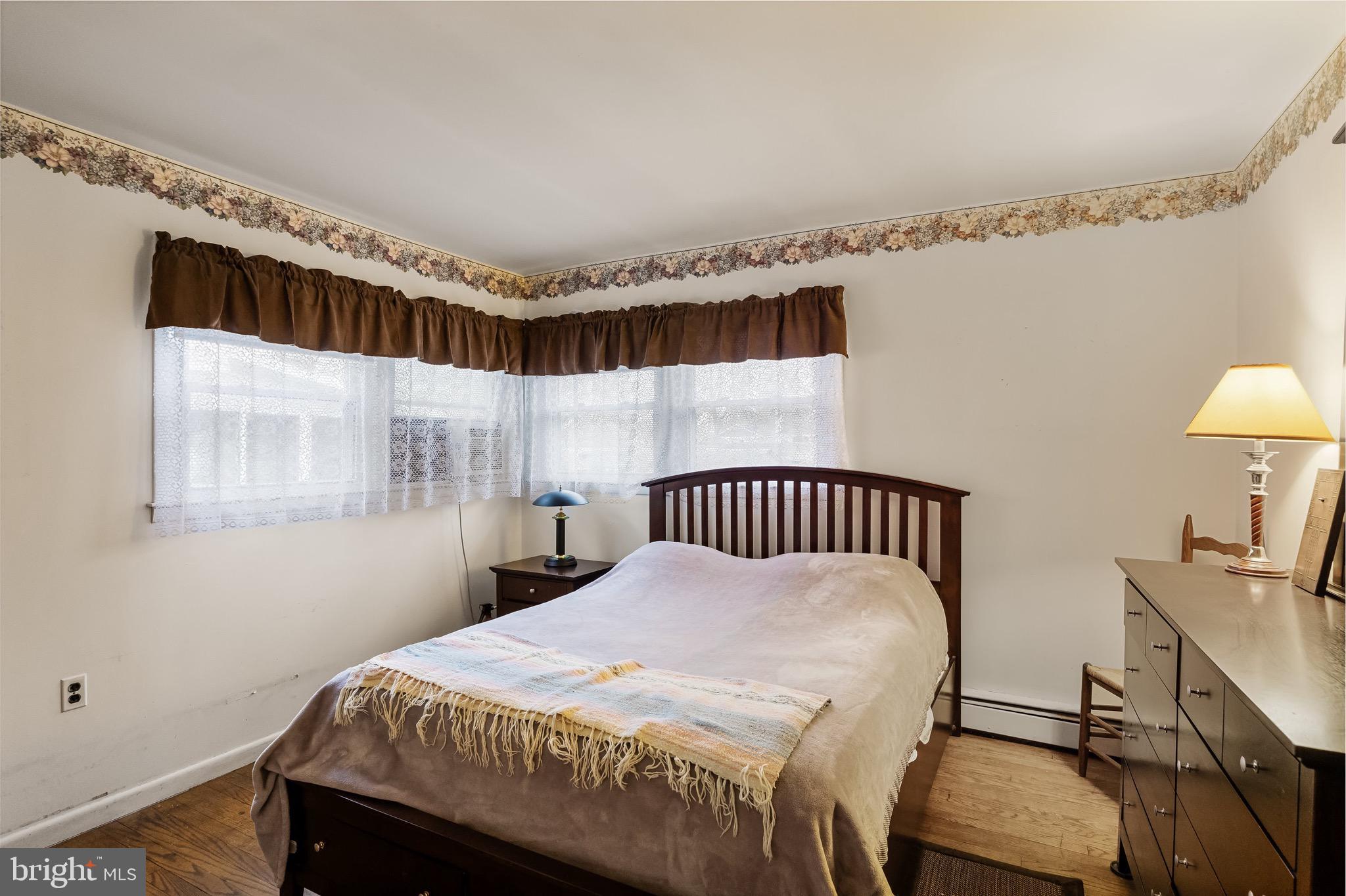 708 Bem Street Riverside, NJ 08075 - Photo 22 of 26 a bedroom with a bed and a table