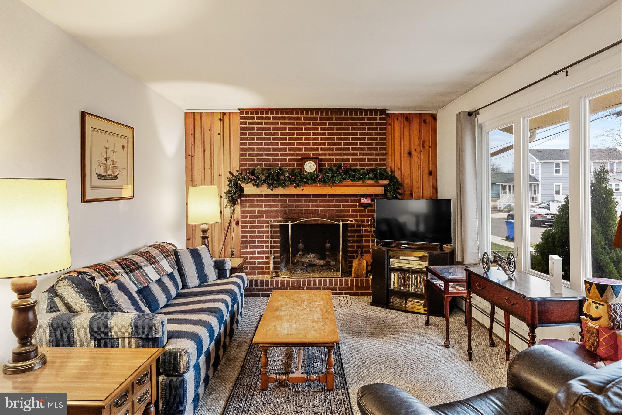 708 Bem Street Riverside, NJ 08075 - Photo 5 of 26 a living room with furniture or couch and a fireplace