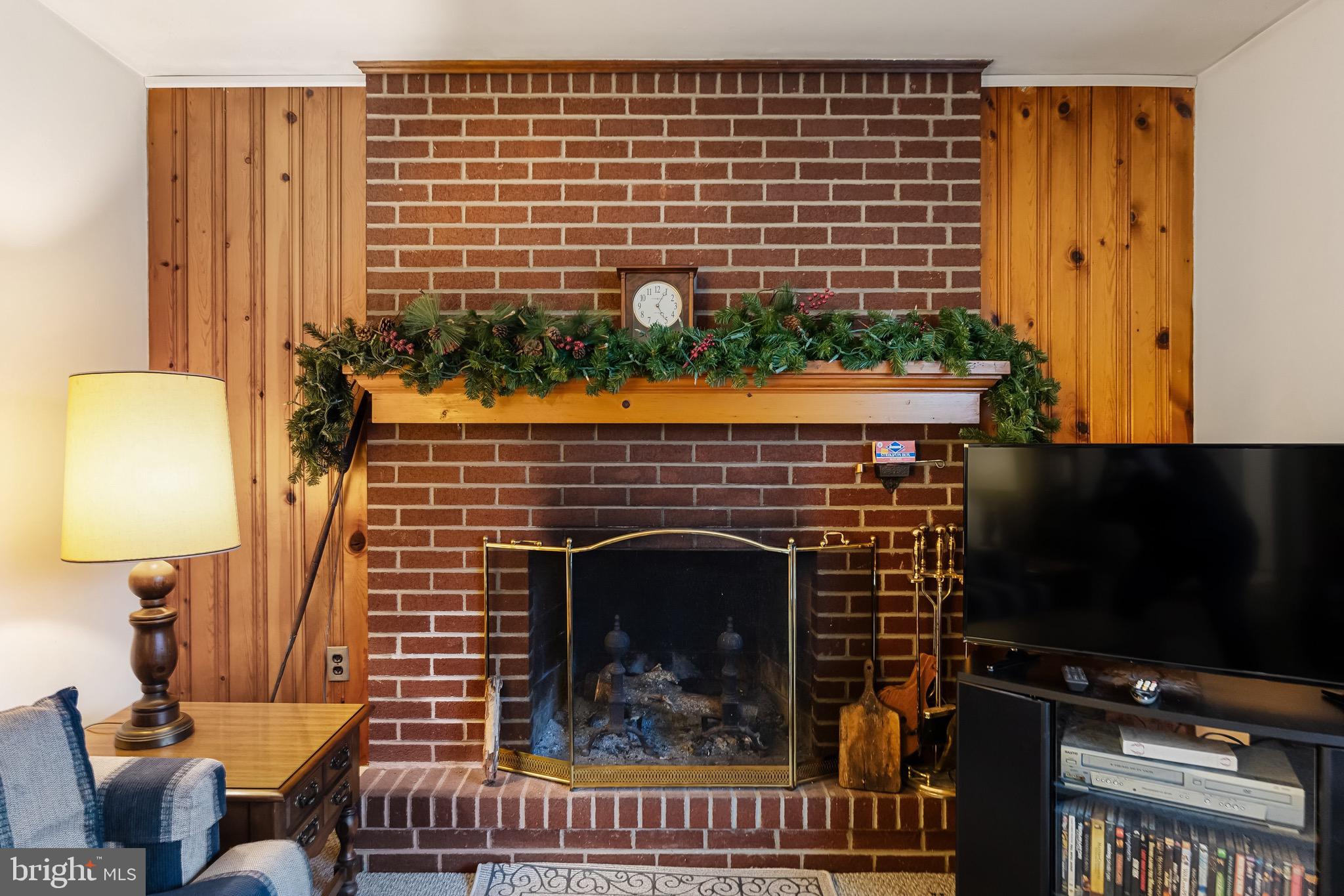 708 Bem Street Riverside, NJ 08075 - Photo 8 of 26 a living room with furniture and a fireplace