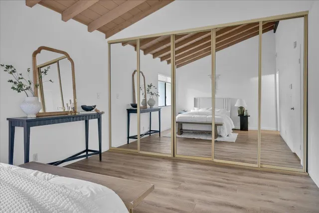 a bedroom with furniture and window