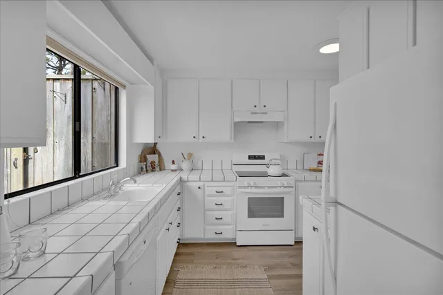 a view of a kitchen with cabinets