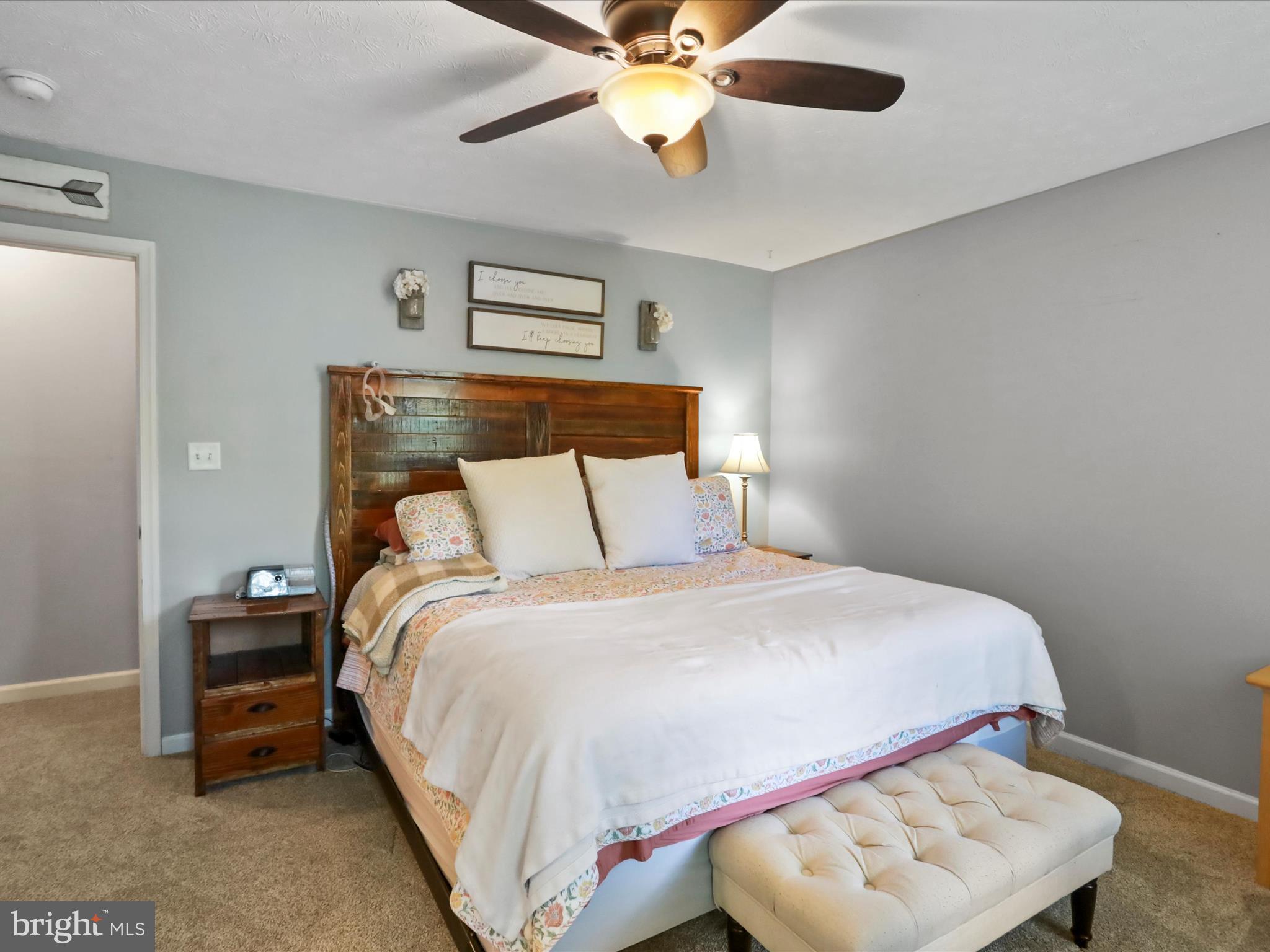 32 Greenfield Road Front Royal, VA 22630 - Photo 11 of 49 a bedroom with a bed and a chandelier