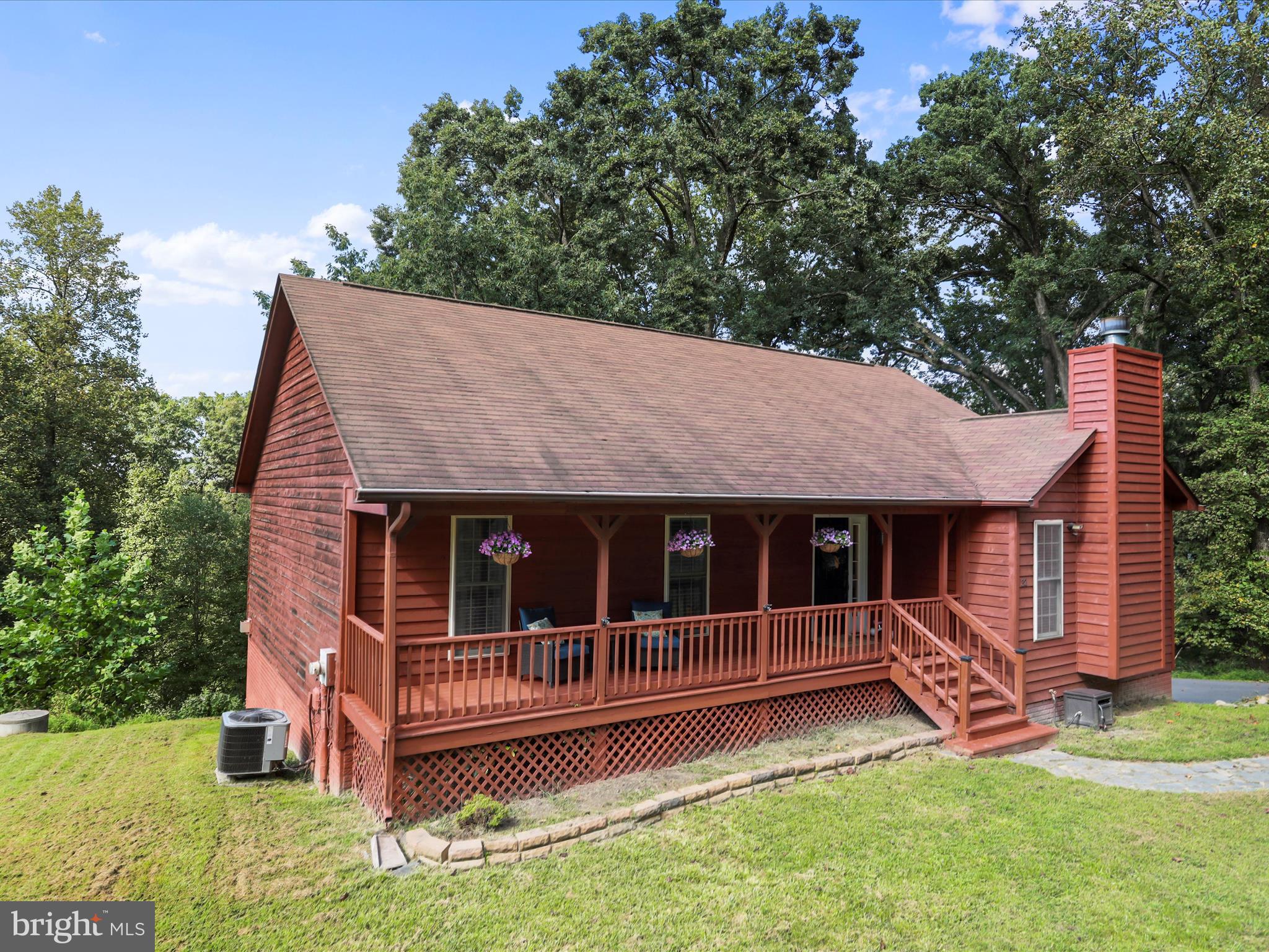 32 Greenfield Road Front Royal, VA 22630 - Photo 2 of 49 a view of a house with a backyard and wooden deck