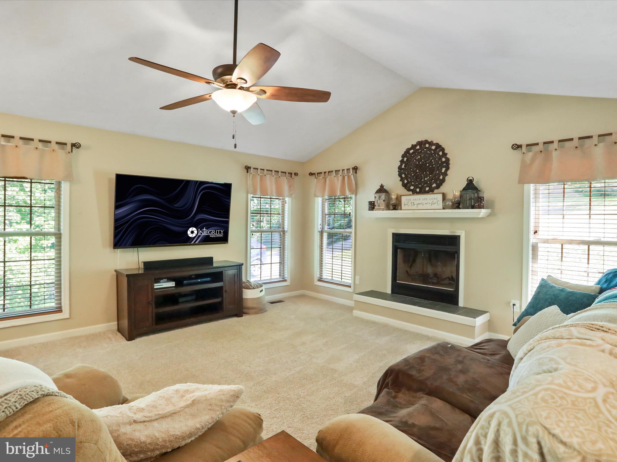 32 Greenfield Road Front Royal, VA 22630 - Photo 27 of 49 a living room with furniture a flat screen tv and a fireplace