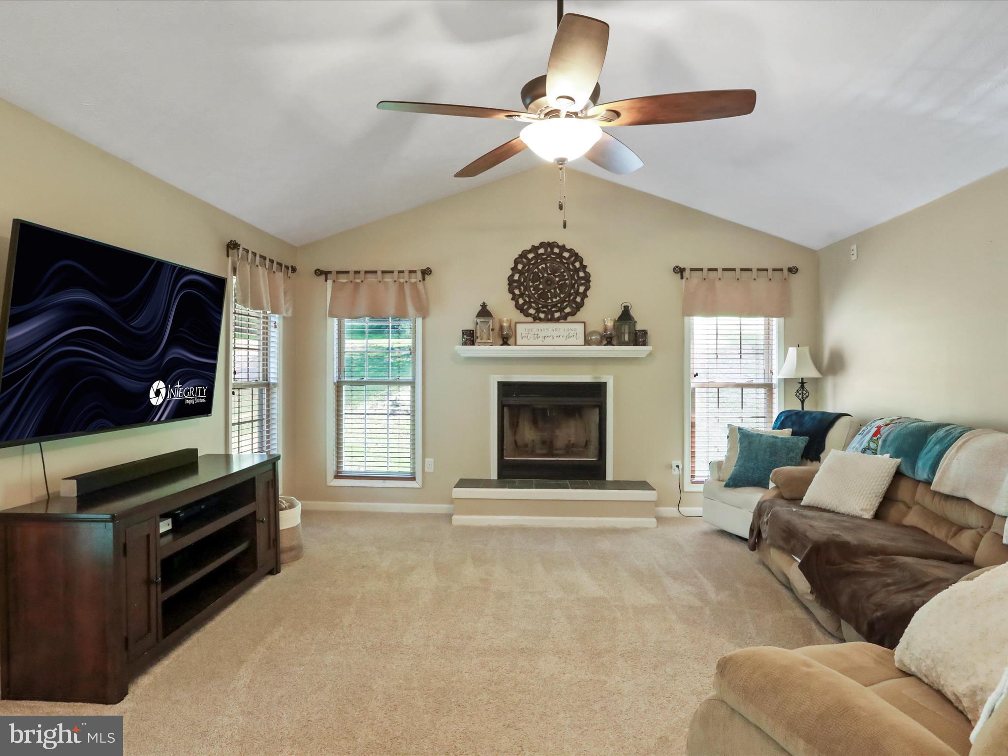 32 Greenfield Road Front Royal, VA 22630 - Photo 28 of 49 a living room with furniture a flat screen tv and a fireplace