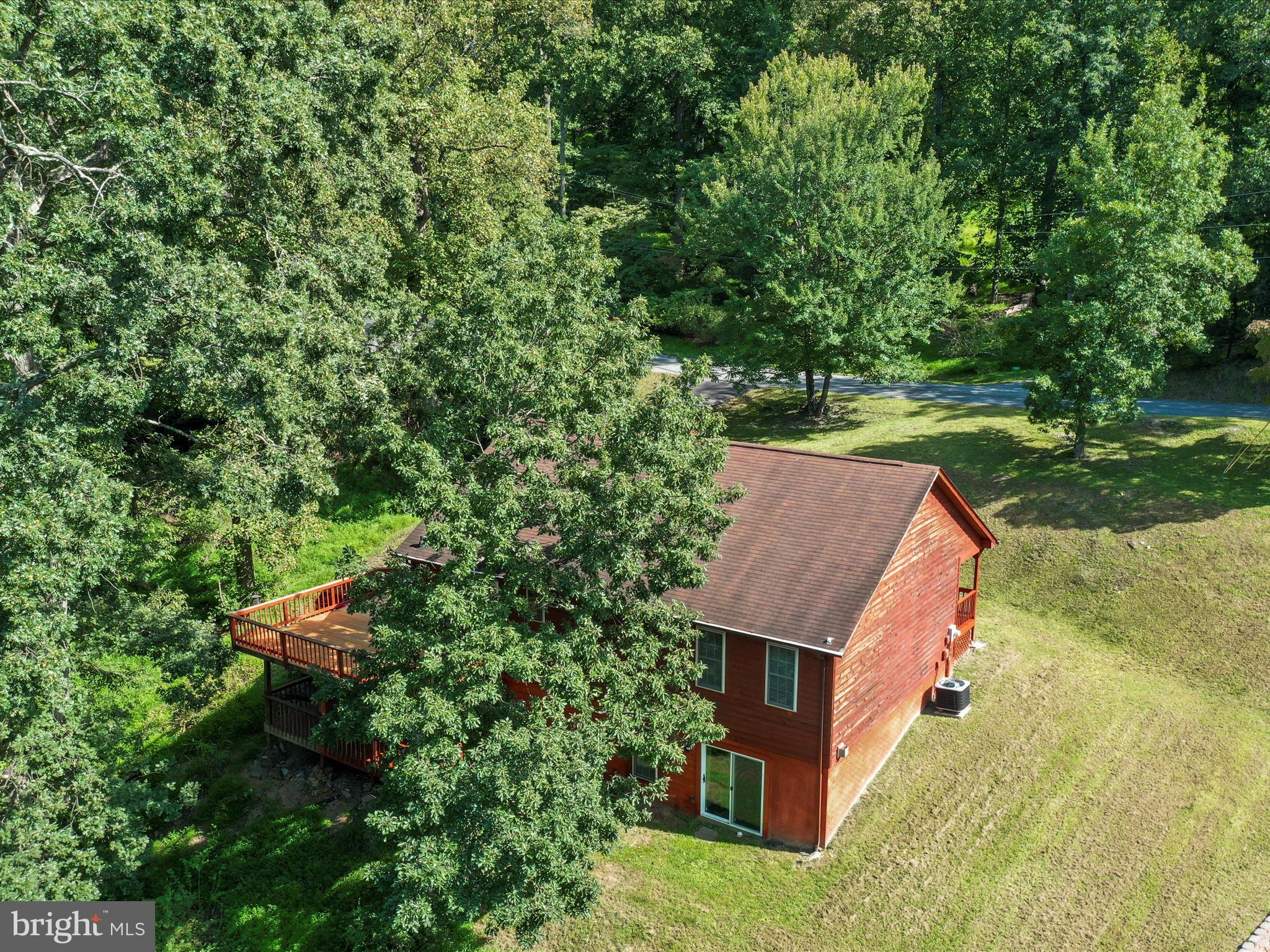 32 Greenfield Road Front Royal, VA 22630 - Photo 36 of 49 an aerial view of a house with a yard and a large tree