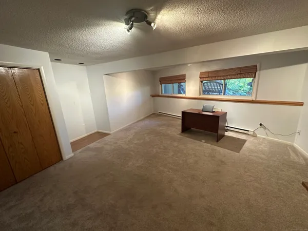 a view of workspace with furniture and a window