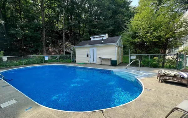 a view of a swimming pool with a patio