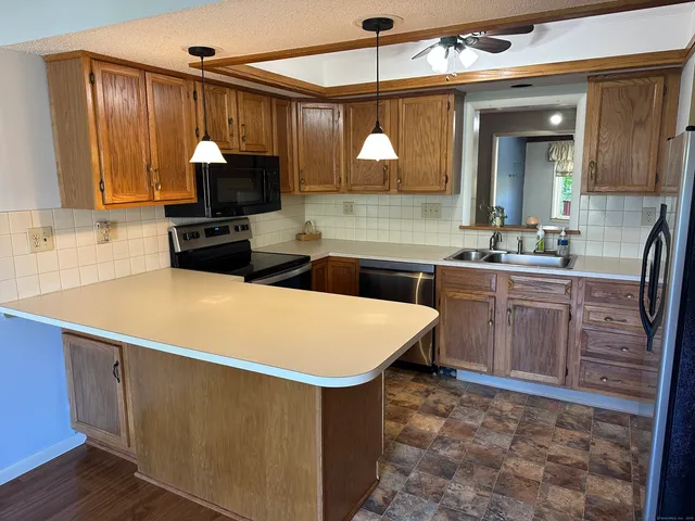 a kitchen with sink cabinets and outdoor space