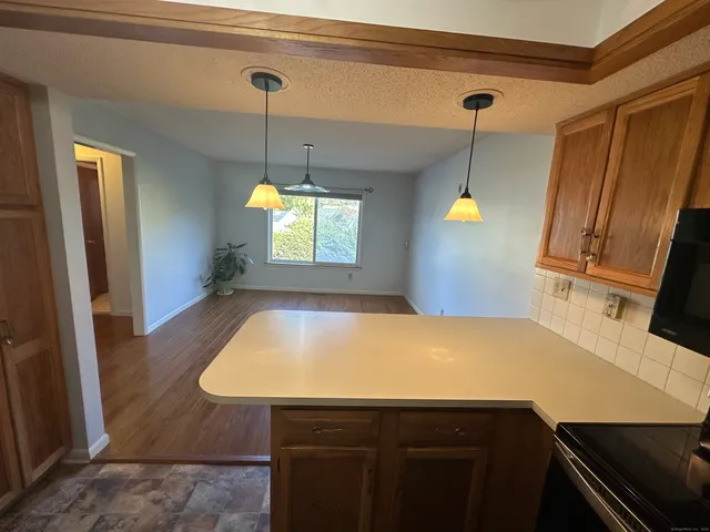 a room with pool table and windows