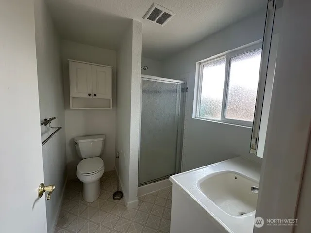 a kitchen with a sink a stove and cabinets