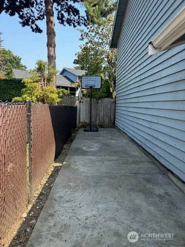 a view of a swimming pool with a patio