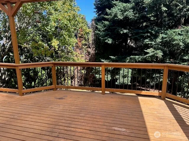 a view of balcony with wooden floor