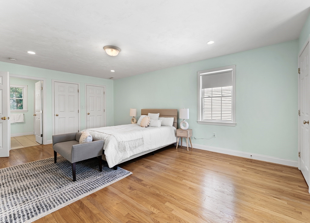 77 Hawthorne Road Waltham, MA 02451 - Photo 15 of 27 a bedroom with a bed and a couch