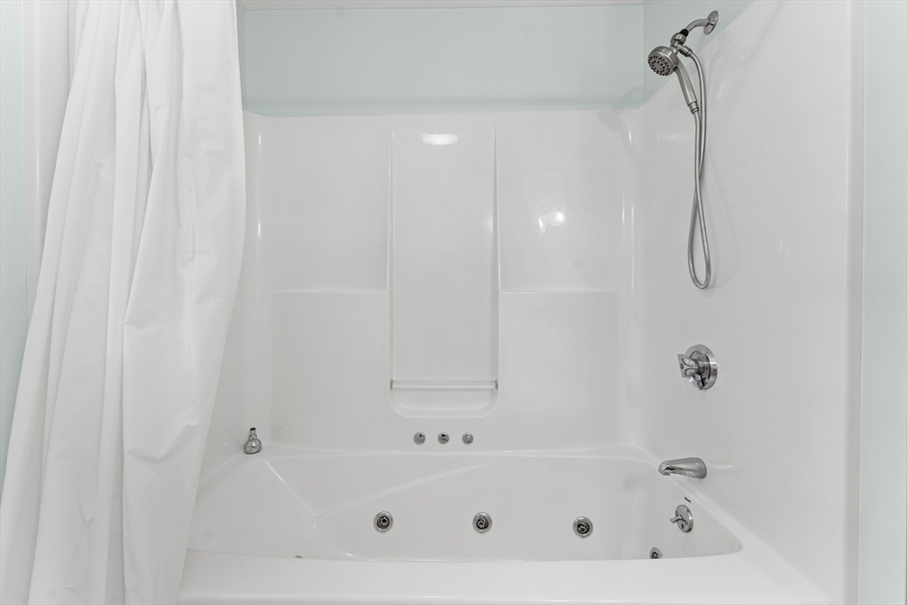 77 Hawthorne Road Waltham, MA 02451 - Photo 17 of 27 a bathroom with a bathtub