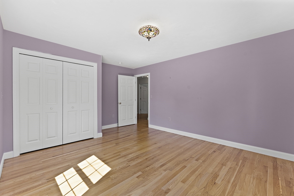 77 Hawthorne Road Waltham, MA 02451 - Photo 19 of 27 a view of empty room with wooden floor