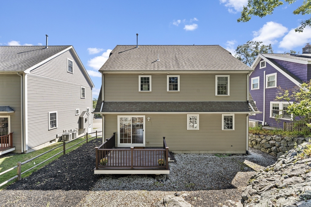 77 Hawthorne Road Waltham, MA 02451 - Photo 24 of 27 a front view of a house with a yard