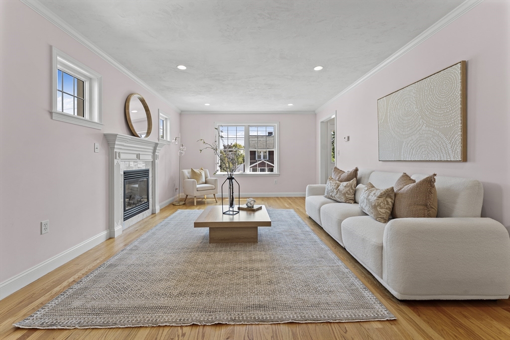 77 Hawthorne Road Waltham, MA 02451 - Photo 6 of 27 a living room with furniture and a fireplace