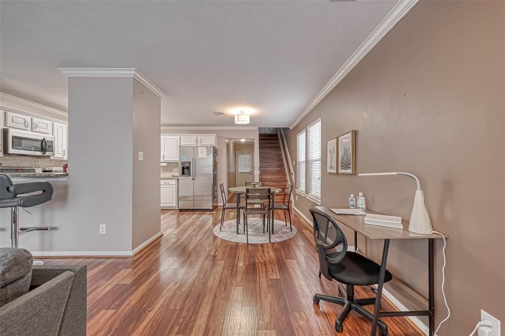 1204 Andrews Street Houston, TX 77019 - Photo 4 of 15 a living room with furniture a wooden floor and a sink
