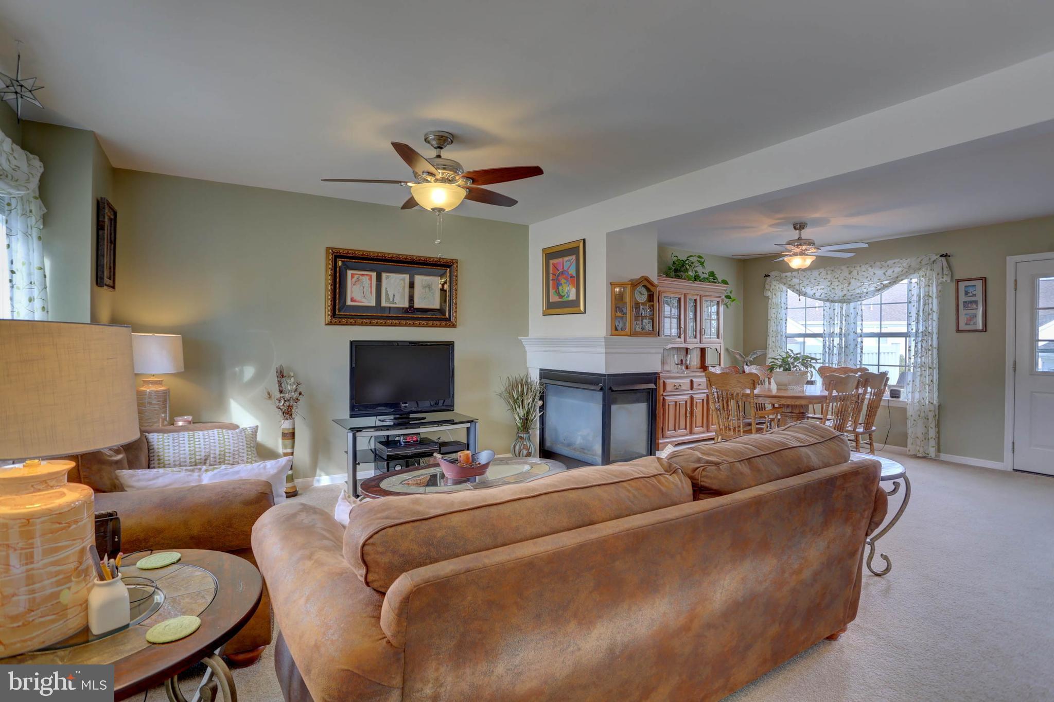 656 Chatham Way Lititz, PA 17543 - Photo 3 of 36 Living room shares gas fireplace
