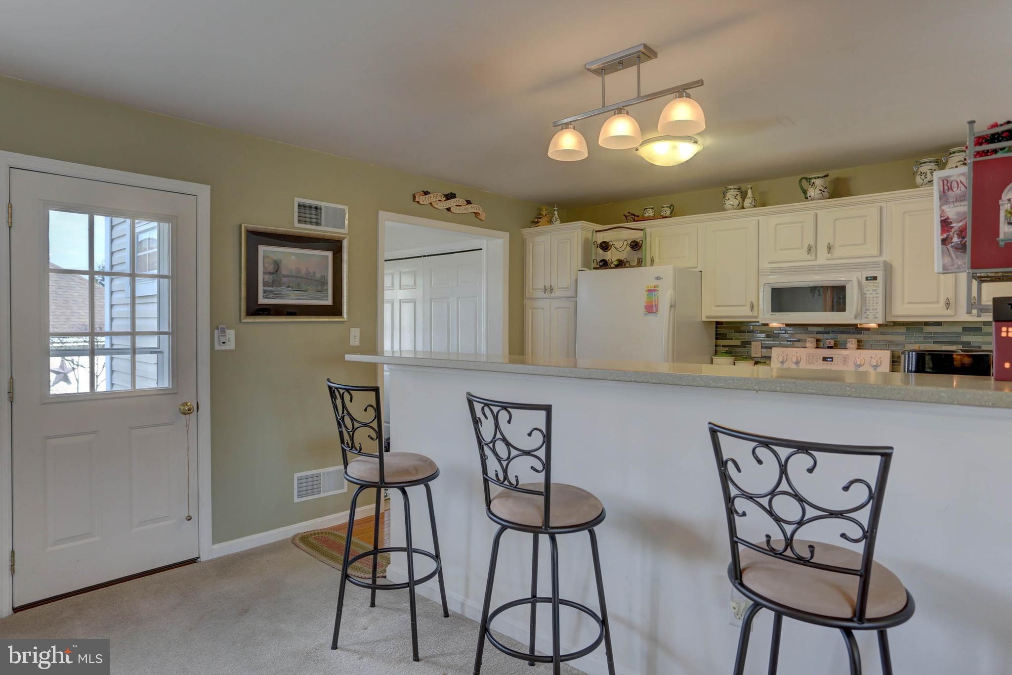 656 Chatham Way Lititz, PA 17543 - Photo 10 of 36 View of bar and door to outside and patio area.