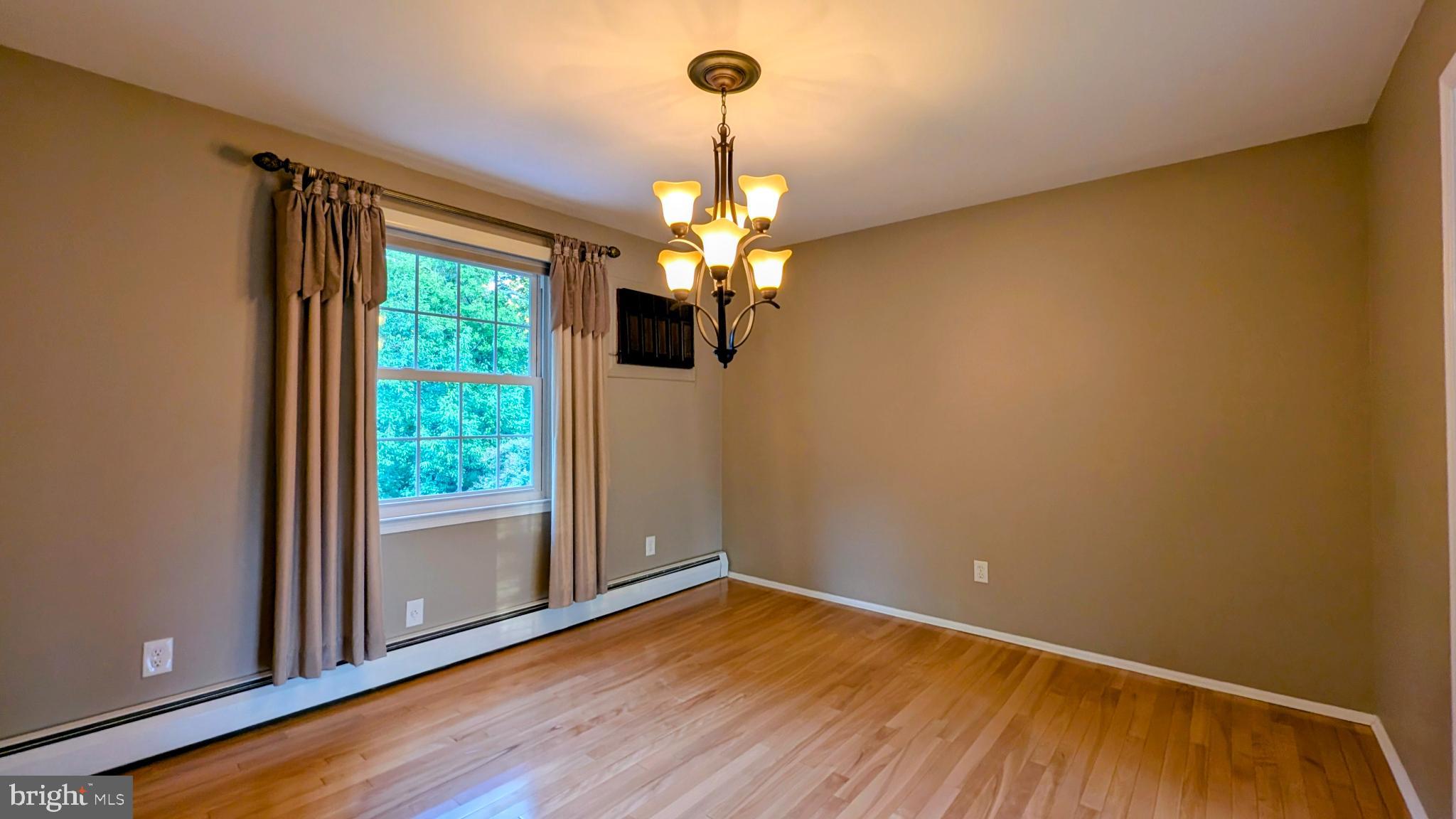 324 West Ridley Avenue Ridley Park, PA 19078 - Photo 12 of 43 a view of empty room with wooden floor and fan