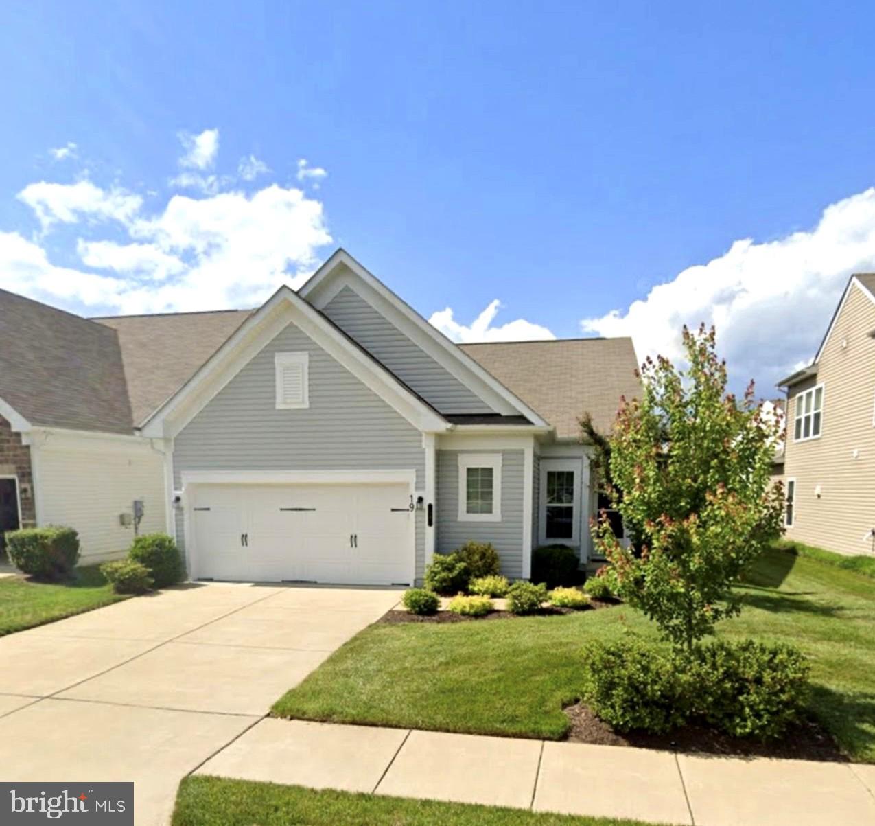 a view of garage yard and tree
