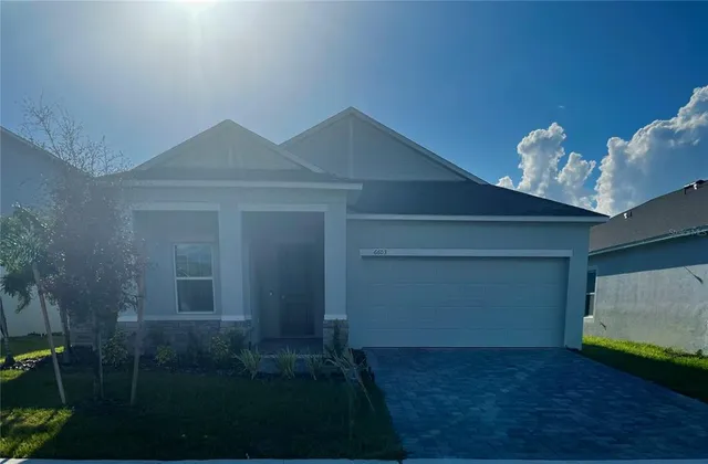 a large kitchen with stainless steel appliances lots of counter top space and cabinets