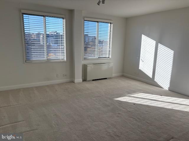 1200 North Nash Street, Unit 1155 Arlington, VA 22209 - Photo 16 of 23 a view of an empty room with a window