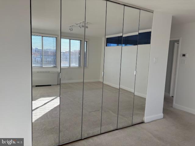 1200 North Nash Street, Unit 1155 Arlington, VA 22209 - Photo 17 of 23 a bathroom with a glass shower door