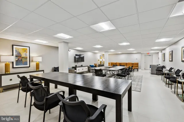 a view of a dining room with furniture and a livingroom