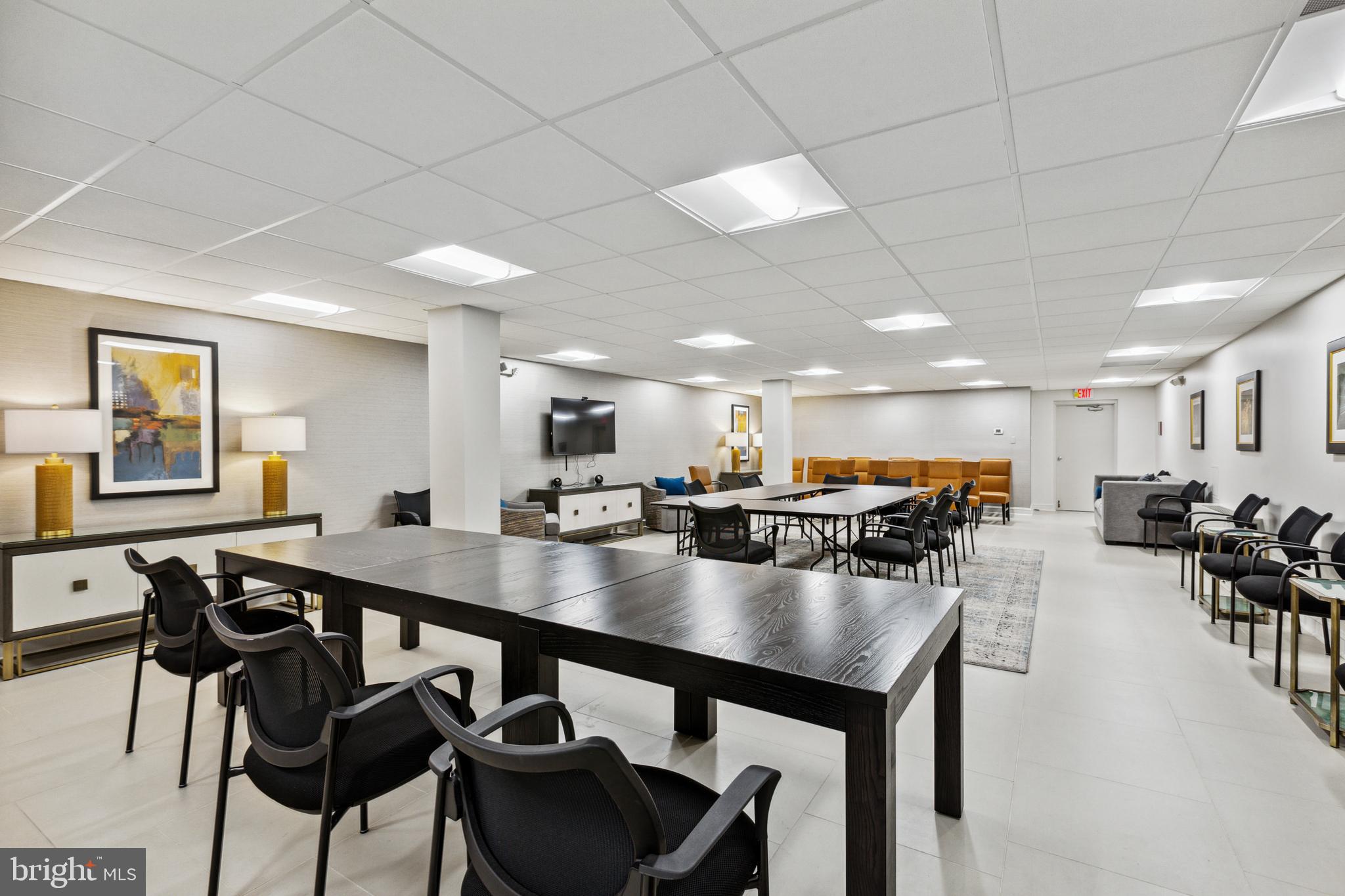 1200 North Nash Street, Unit 1155 Arlington, VA 22209 - Photo 18 of 23 a view of a dining room with furniture and a livingroom