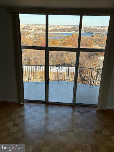 1200 North Nash Street, Unit 1155 Arlington, VA 22209 - Photo 10 of 23 a view of an empty room with wooden floor and a window