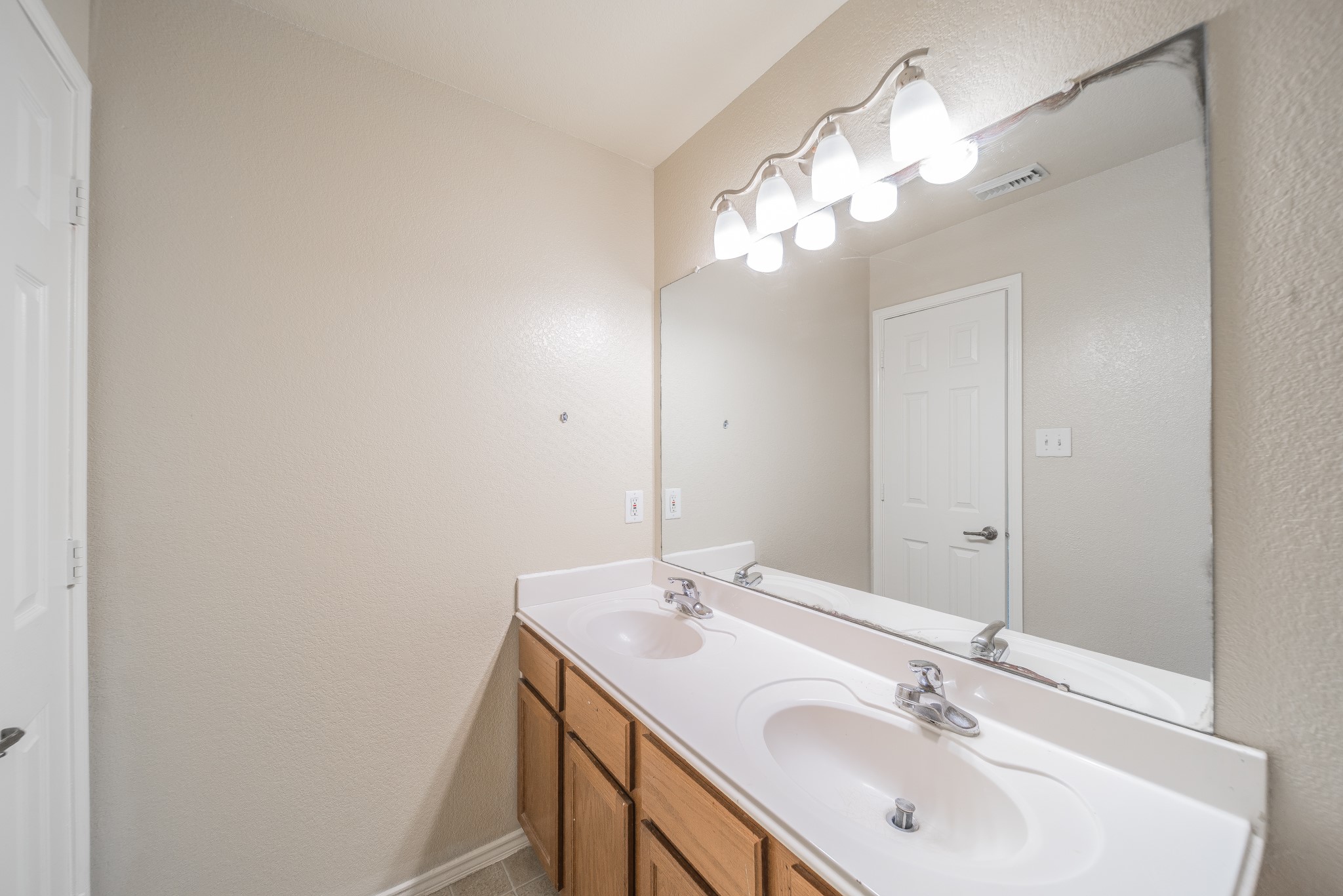 22802 Sherioaks Lane Spring, TX 77389 - Photo 13 of 21 a bathroom with a sink and a mirror