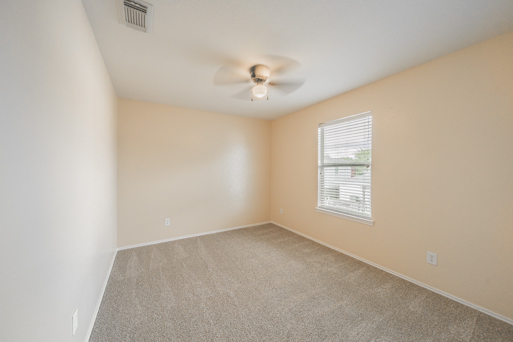 22802 Sherioaks Lane Spring, TX 77389 - Photo 15 of 21 an empty room with windows and fan