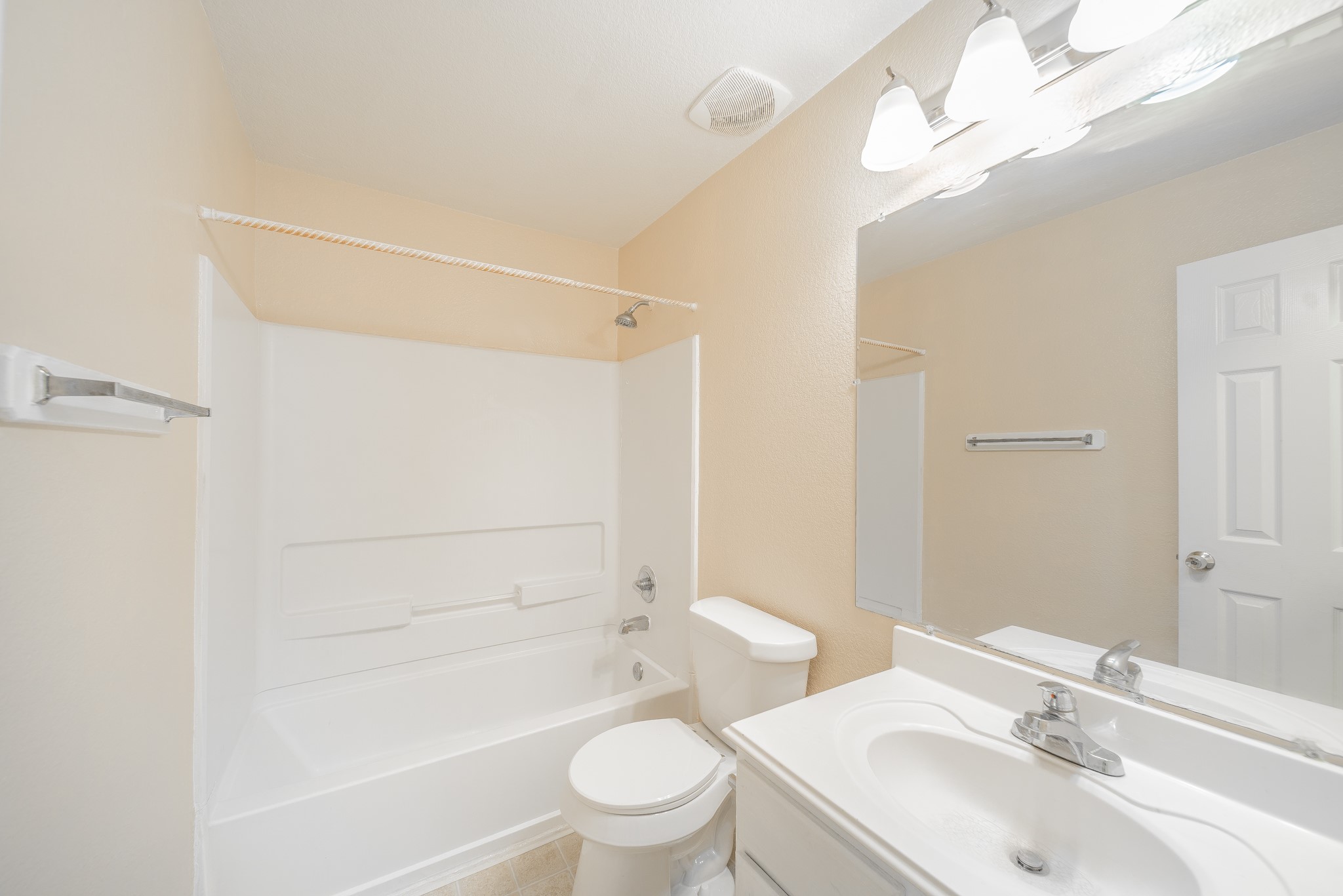 22802 Sherioaks Lane Spring, TX 77389 - Photo 17 of 21 a bathroom with a bathtub shower sink vanity mirror and toilet
