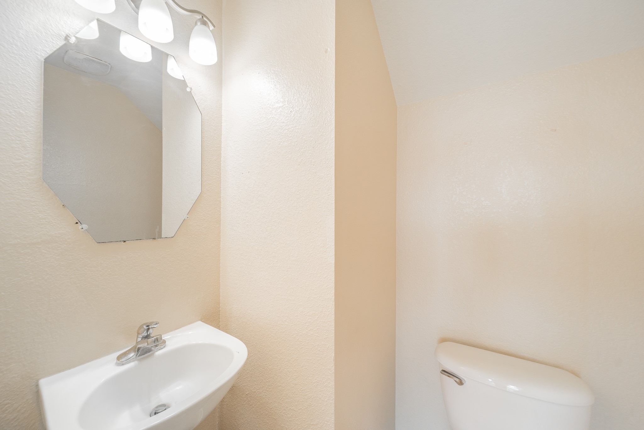 22802 Sherioaks Lane Spring, TX 77389 - Photo 19 of 21 a bathroom with a sink mirror and vanity