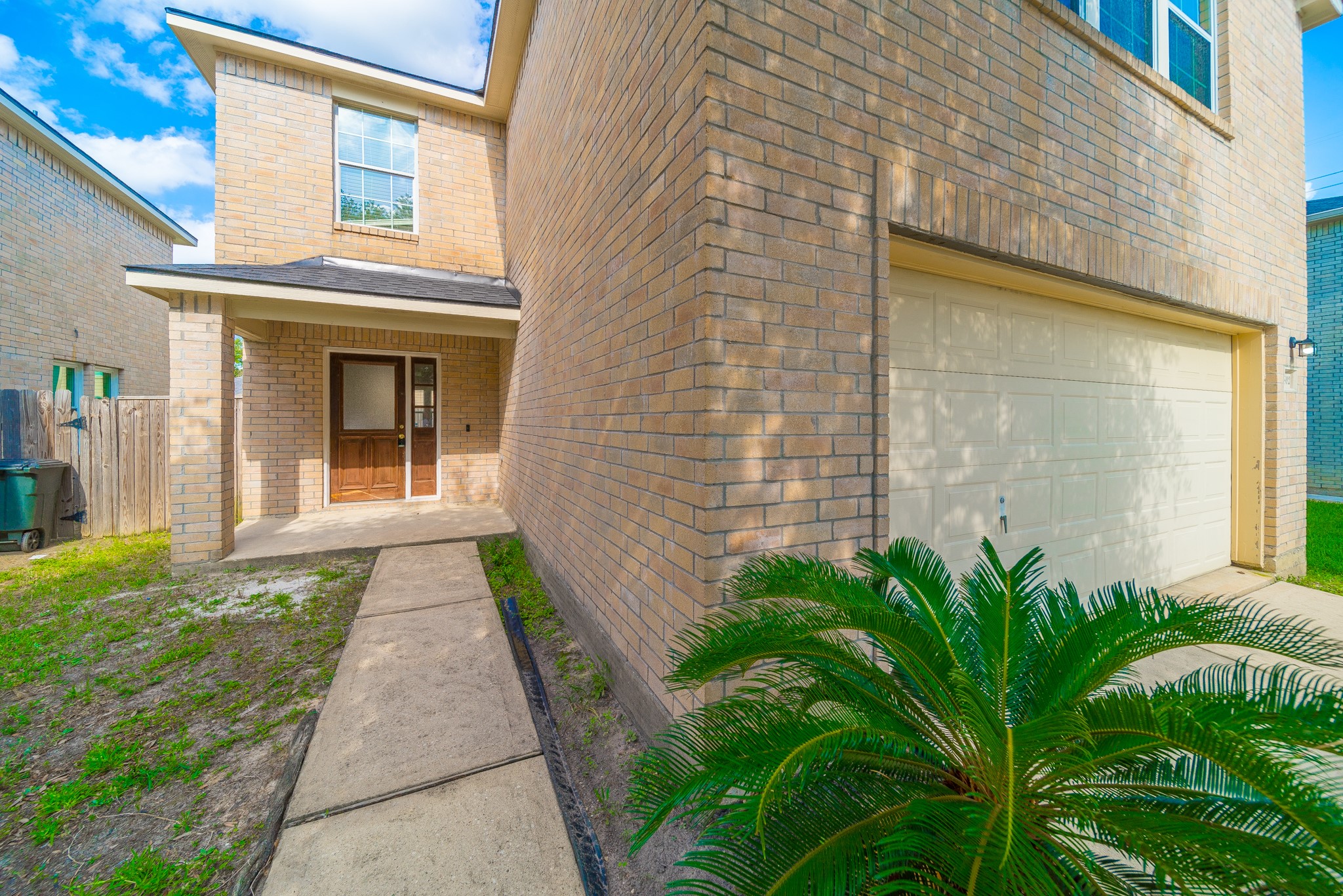 22802 Sherioaks Lane Spring, TX 77389 - Photo 2 of 21 a front view of a house with a garden