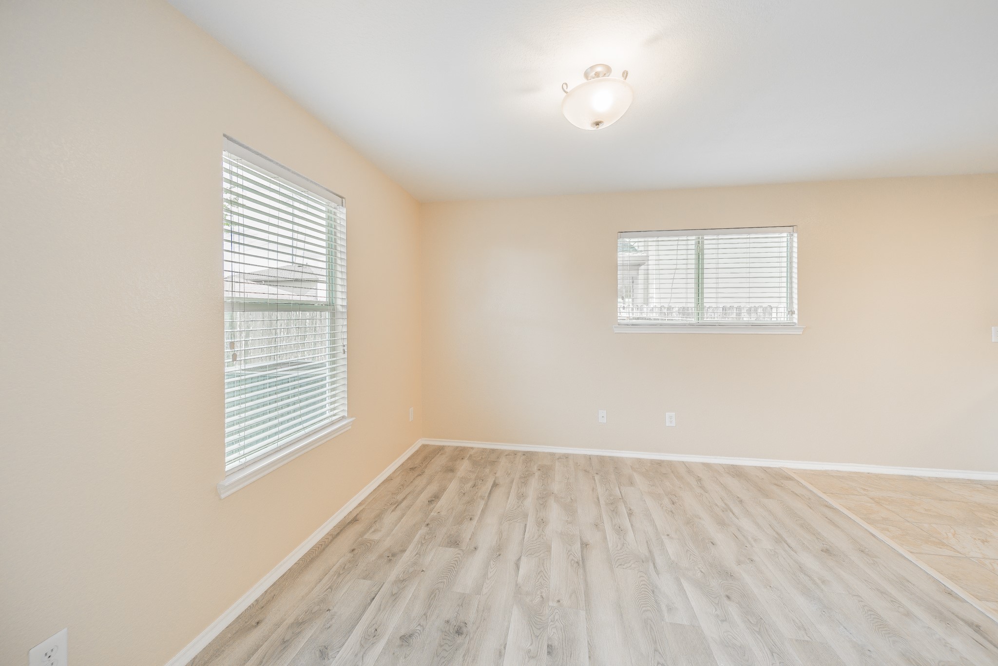 22802 Sherioaks Lane Spring, TX 77389 - Photo 7 of 21 an empty room with wooden floor and windows