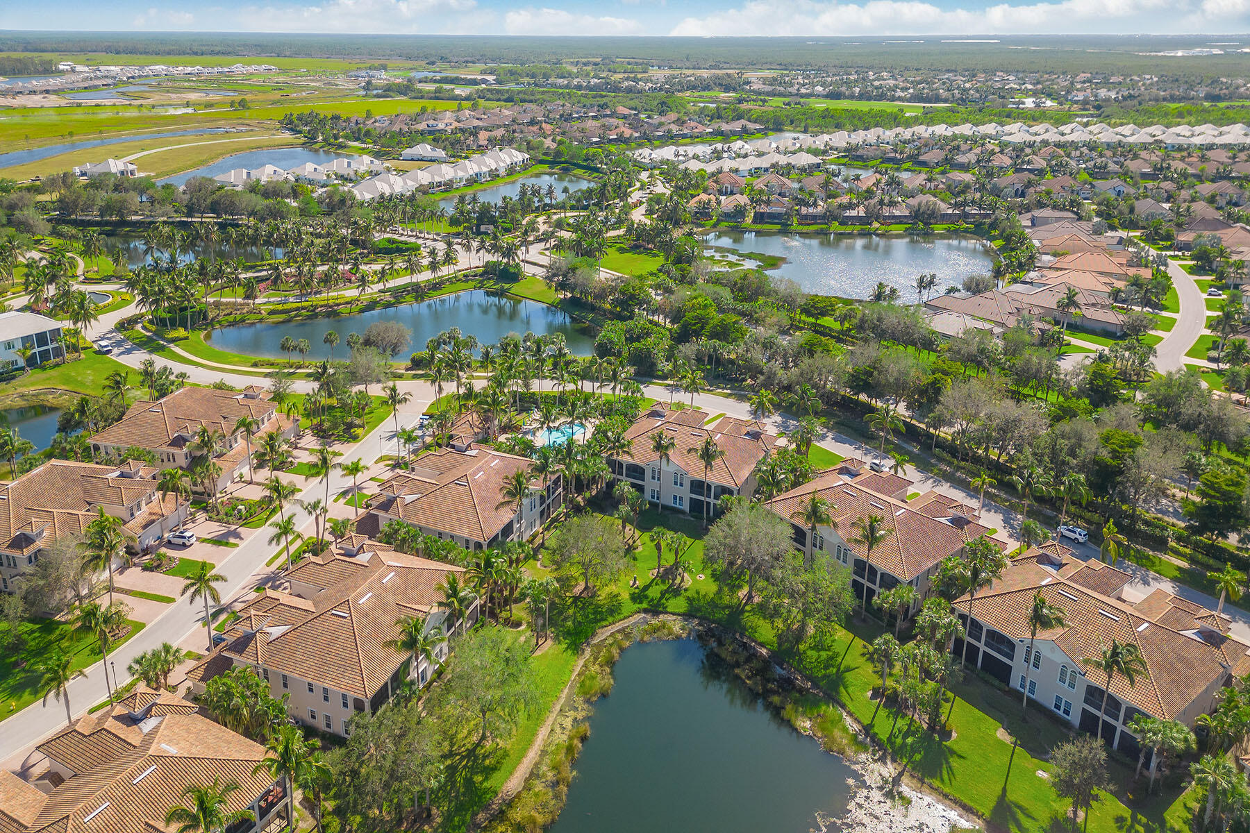3189 Aviamar Circle, Unit 202 Naples, FL 34114 - Photo 29 of 50 an aerial view of residential houses with outdoor space