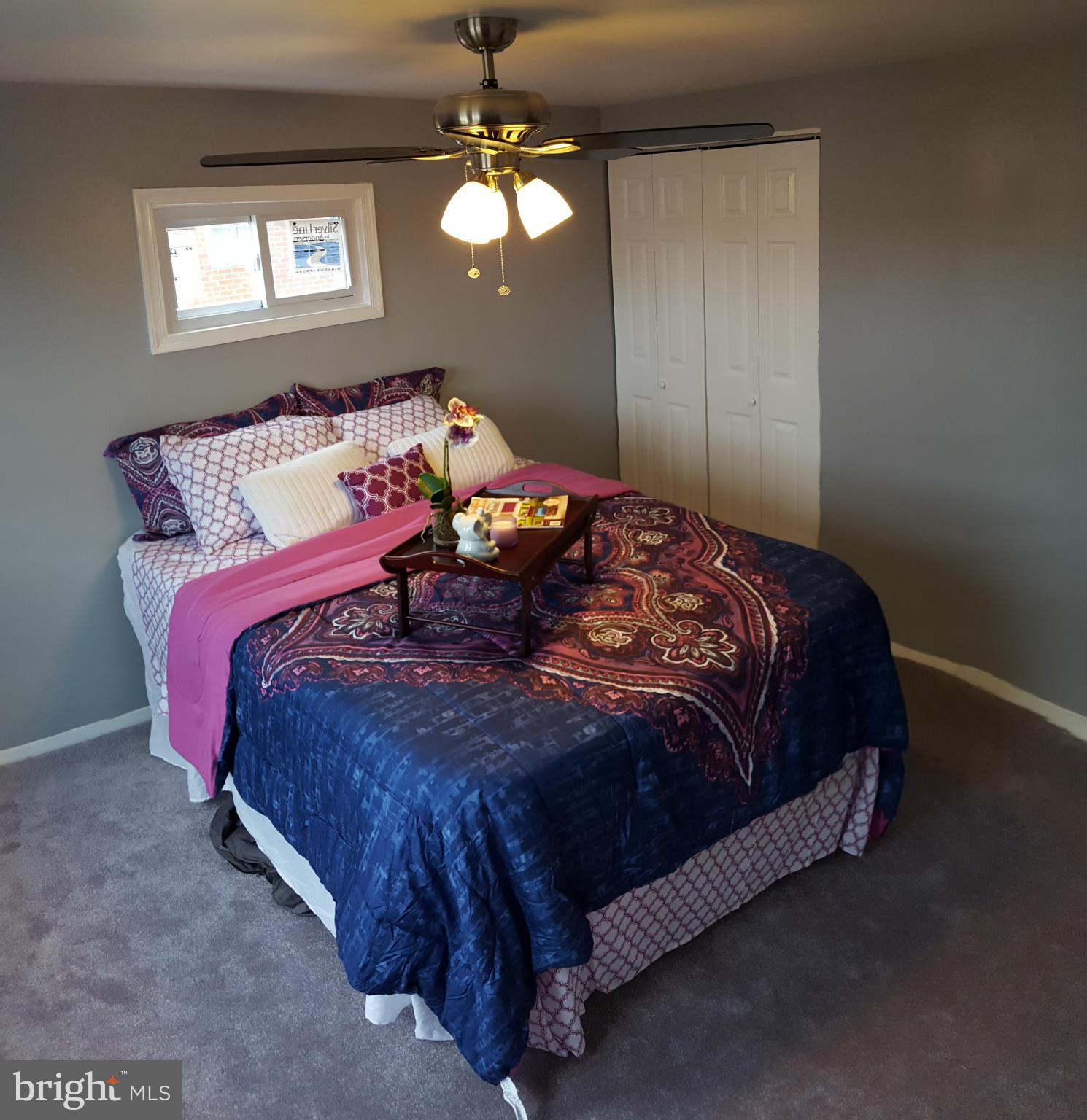 1034 Middleborough Road Baltimore, MD 21221 - Photo 13 of 29 a bedroom with a bed and window