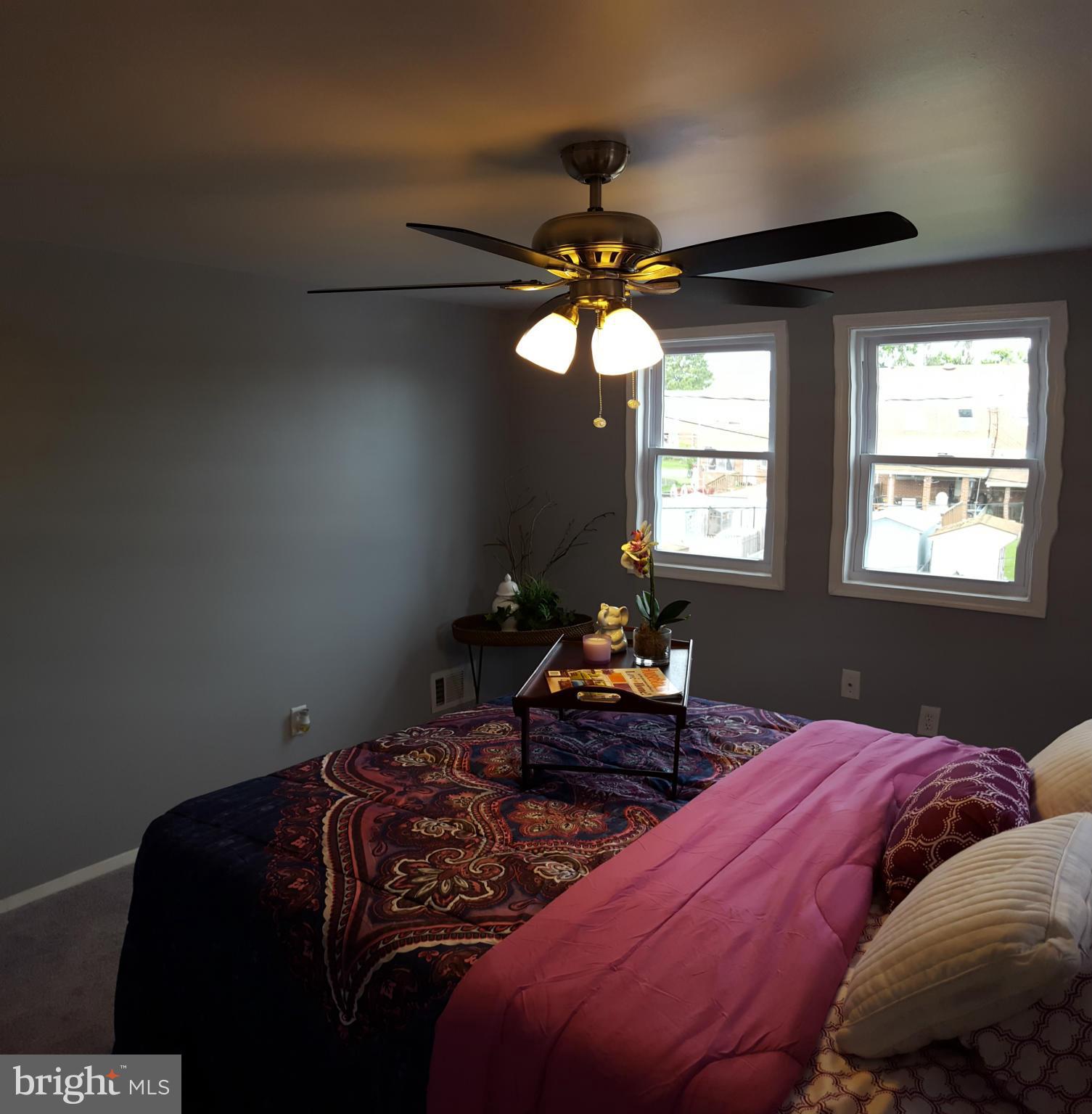 1034 Middleborough Road Baltimore, MD 21221 - Photo 14 of 29 a bedroom with two beds and a chandelier