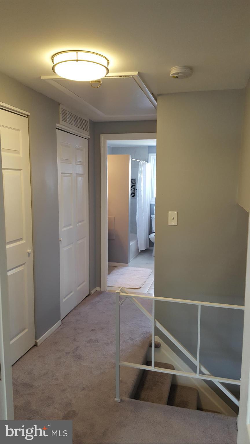 1034 Middleborough Road Baltimore, MD 21221 - Photo 18 of 29 a view of a hallway with a chandelier